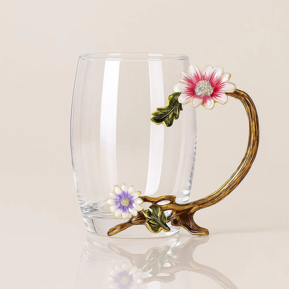 Elegant crystal glass tea cup with gold-tone handle and flowers