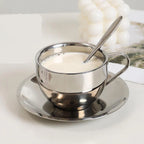 Modern Metallic Coffee Cup and Saucer Set – Top View Displaying Circular Design